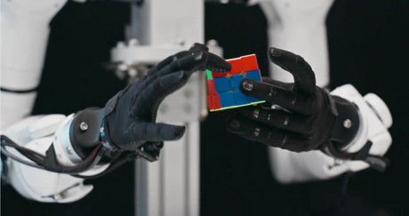 Genesis AI robotic hand performing dexterous manipulation for embodied AI and physical robotics systems